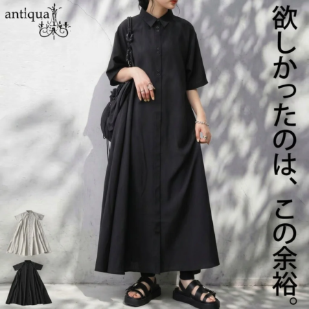 黒のロング丈シャツワンピースを着用した女性