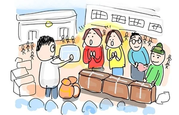 物資を配給する男性